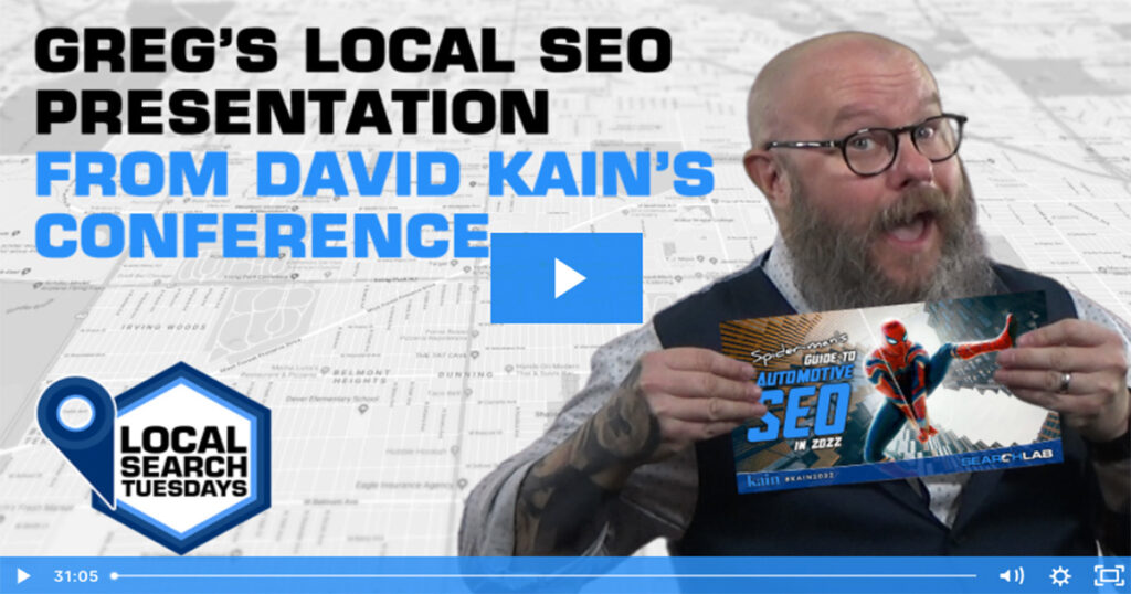 greg holding a slideshow image of Spiderman's Guide to Automotive SEO