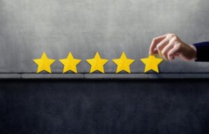 Photo of hand placing stars on shelf